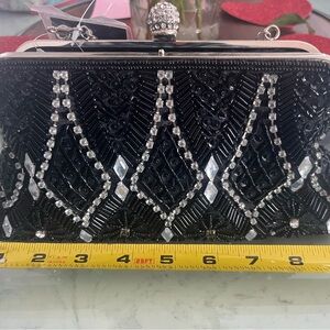 Elegant 9” d’marteaux Black Beaded Clutch has never been used. It still has tags